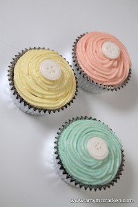 button baby shower cupcakes pink yellow blue
